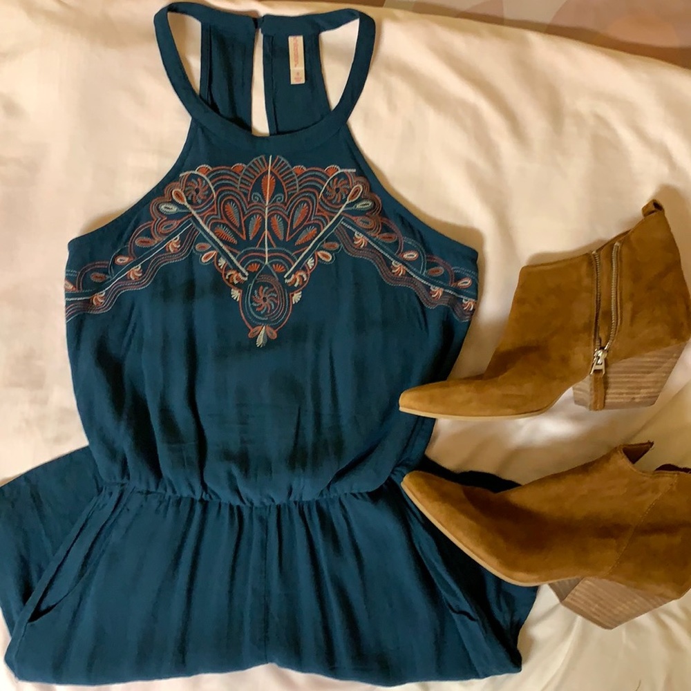 Racerback Blue Romper With Detailed Neckline.
